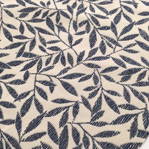 blue leaf pattern on a cream background fabric