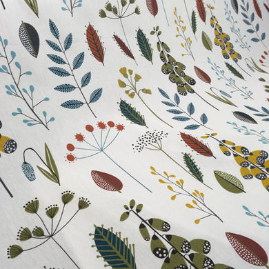 a stylish scandi floral and leaf cotton print fabric with bold colours on a neutral base