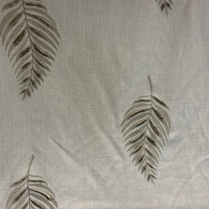 embroidered leaf fabric on a beige background