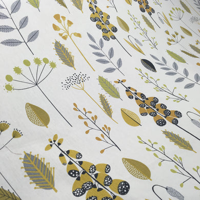 a stylish scandi floral and leaf cotton print fabric with bold colours on a neutral base